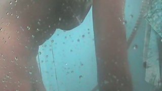 Hot young couple taking an outdoor steamy shower sex